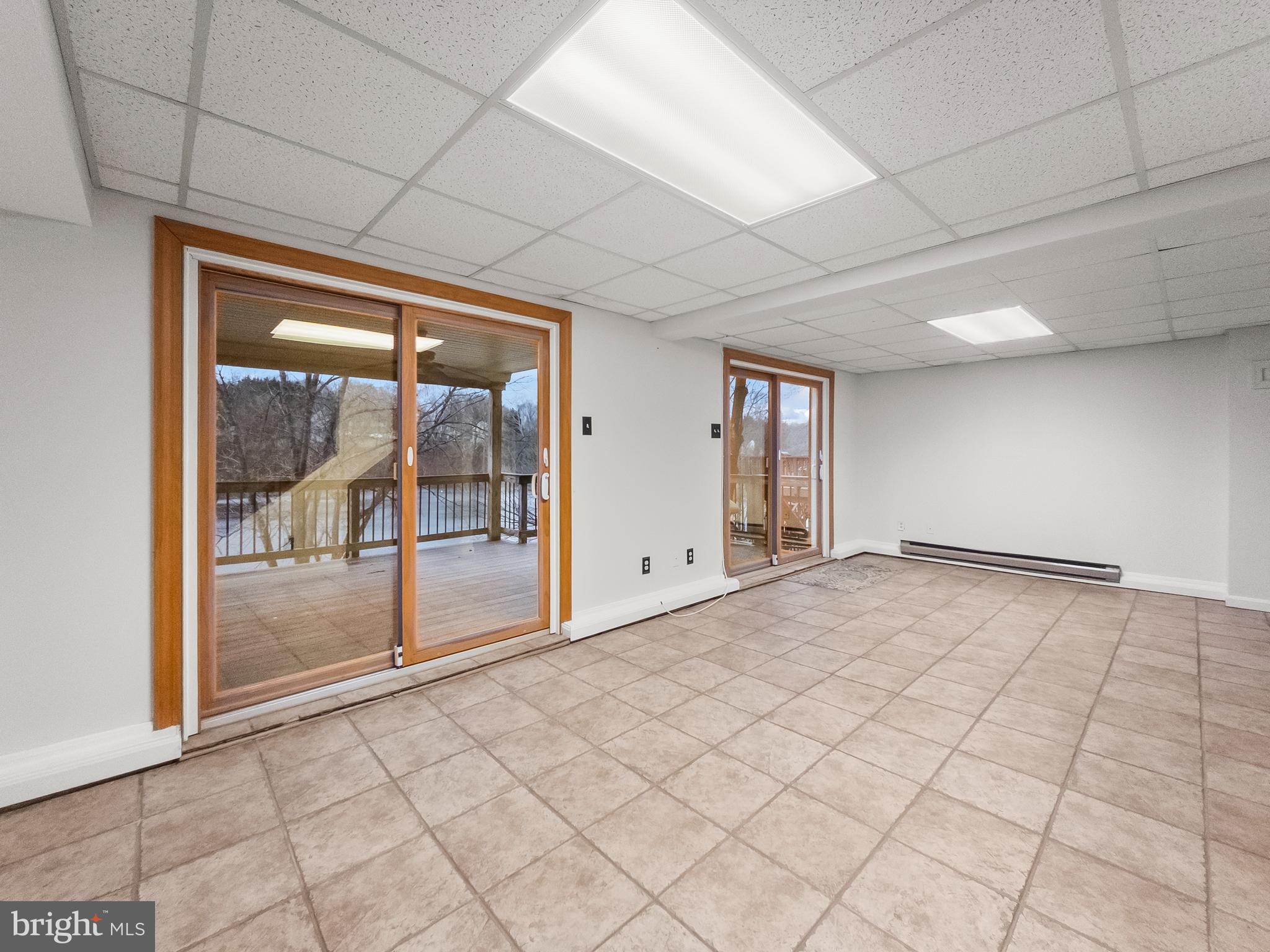 6586 Hemlock Point Road New Market, MD 21774 - Photo 17 of 19 Lower level with double doors to trex deck.