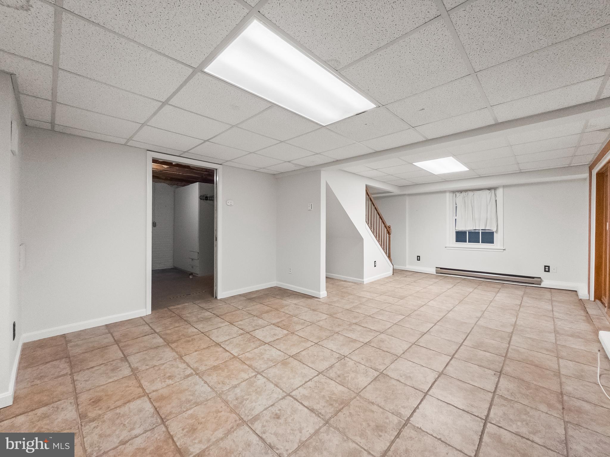 6586 Hemlock Point Road New Market, MD 21774 - Photo 18 of 19 Basement rec room with storage and laundry