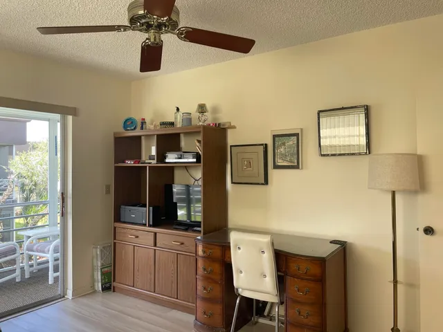 a view of living room with furniture and flat screen tv