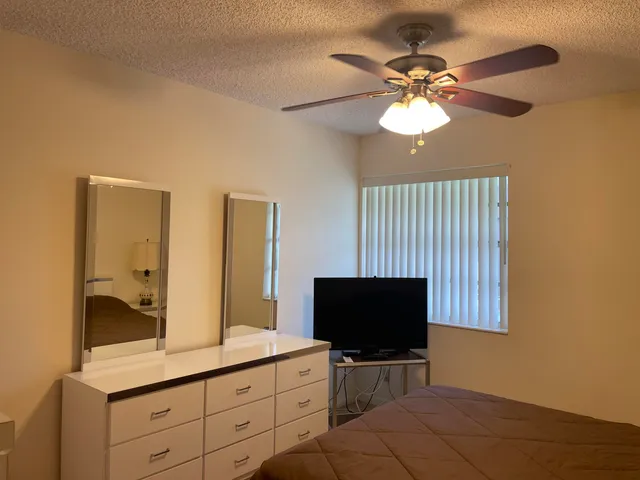 a bathroom with a double vanity sink and mirror