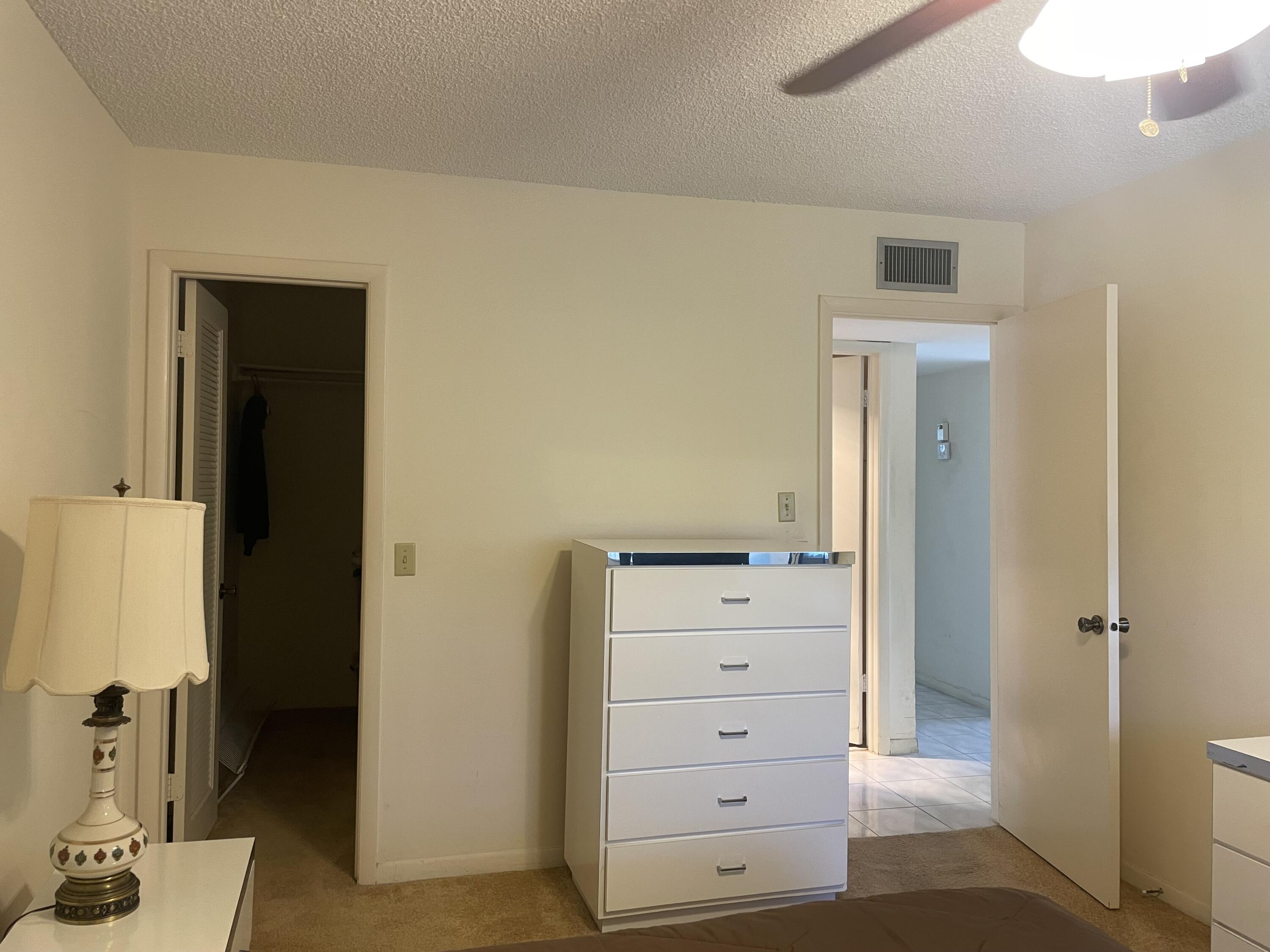 705 Normandy Lane, Unit 705 Delray Beach, FL 33484 - Photo 33 of 37 a view of walk in closet