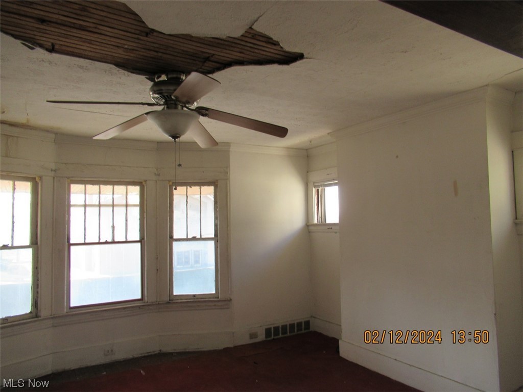 1863 Noble Road Cleveland, OH 44112 - Photo 9 of 16 Unfurnished room featuring plenty of natural light and ceiling fan