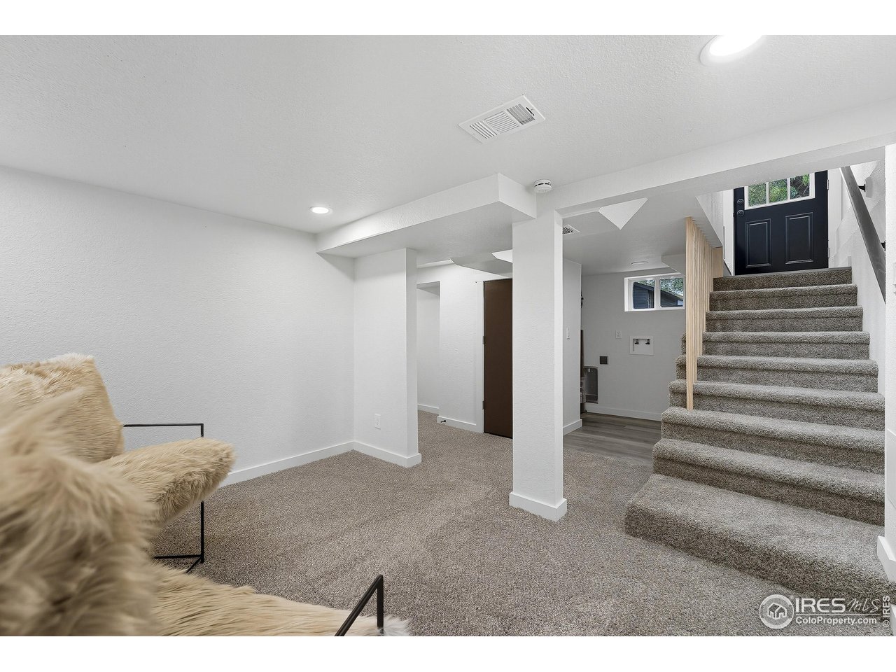 200 Bishop Street Fort Collins, CO 80521 - Photo 17 of 32 a living room with furniture and a flat screen tv
