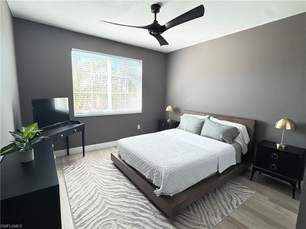 1190 Reserve Way, Unit 304 Naples, FL 34105 - Photo 15 of 20 a bedroom with bed furniture and a window