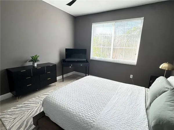 a bedroom with a bed and a dressers