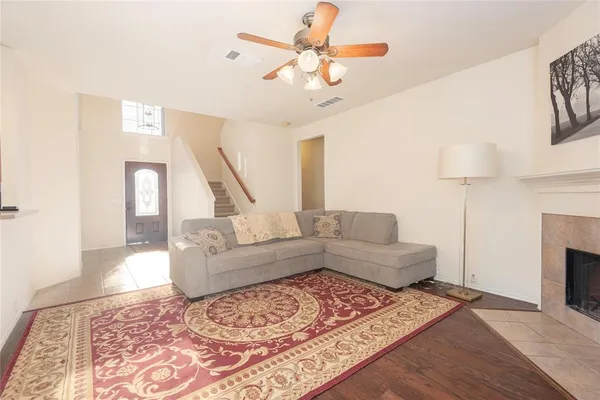 a living room with furniture and a fireplace
