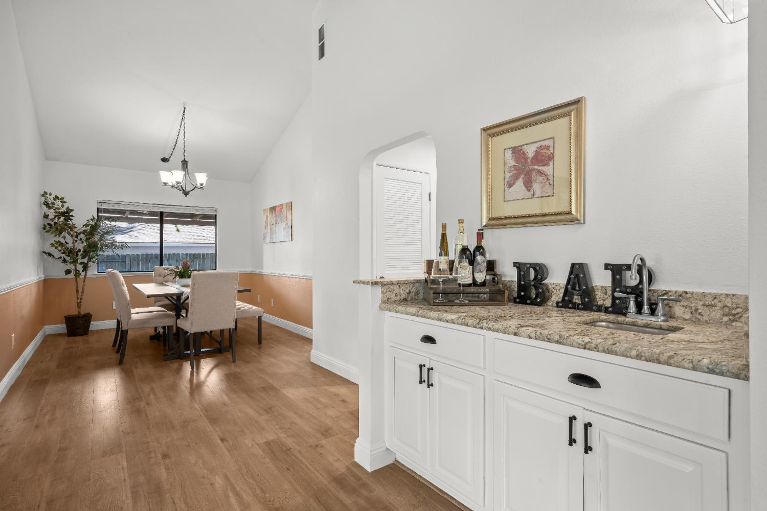 6427 Wittenham Way Orangevale, CA 95662 - Photo 12 of 51 a living room with granite countertop furniture a fireplace and a chandelier