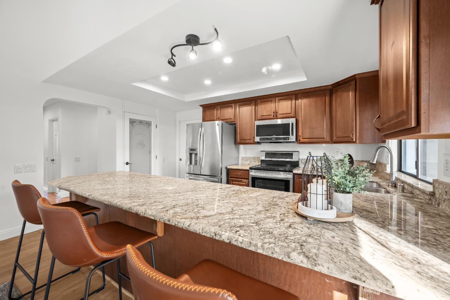 6427 Wittenham Way Orangevale, CA 95662 - Photo 19 of 51 a kitchen with a stove a sink and a refrigerator