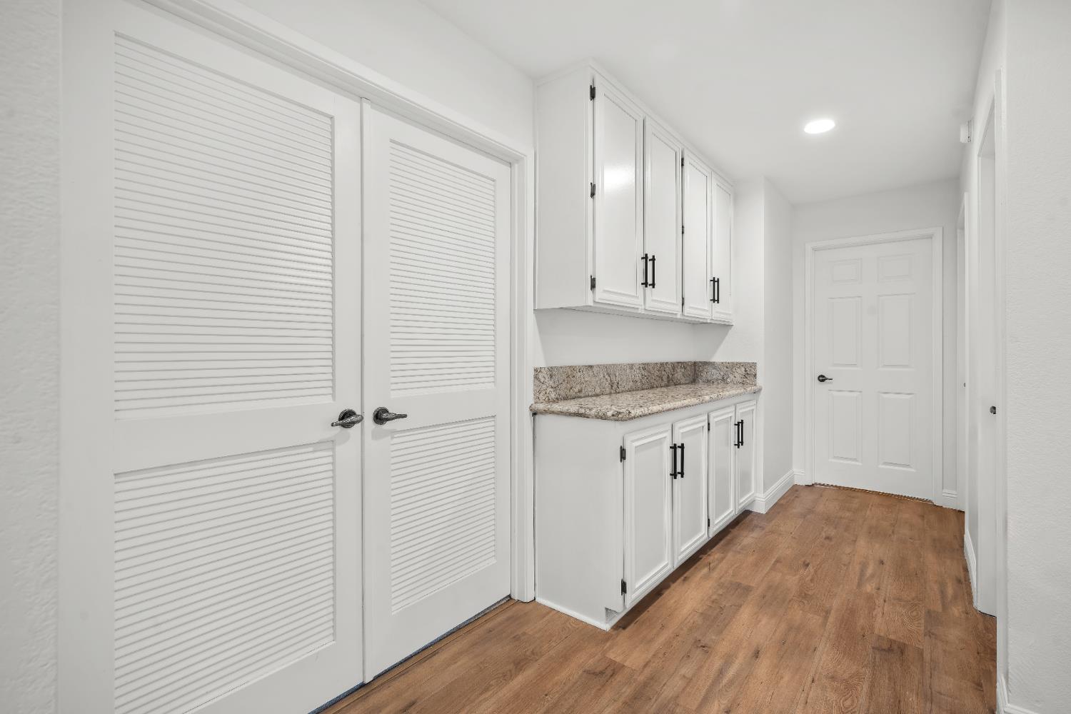 6427 Wittenham Way Orangevale, CA 95662 - Photo 29 of 51 a kitchen with granite countertop white cabinets and white appliances