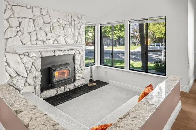a living room with furniture and a rug
