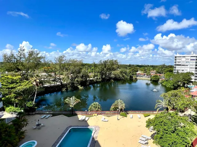 a view of a lake in middle of the house