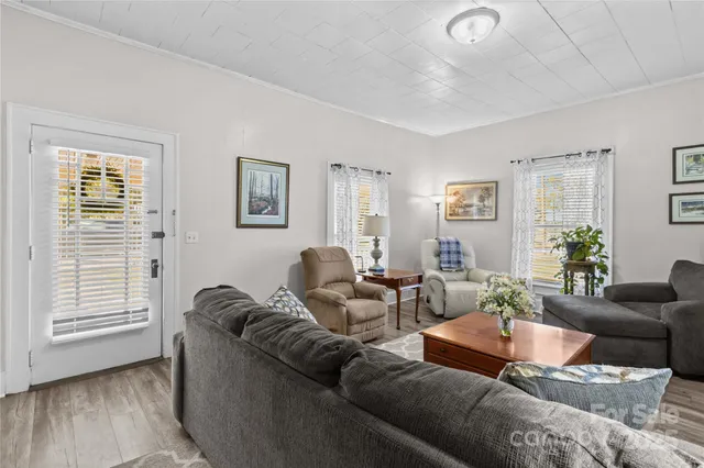 a living room with furniture and a window