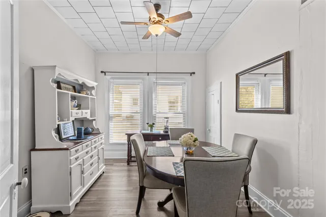 a dining room with furniture and window