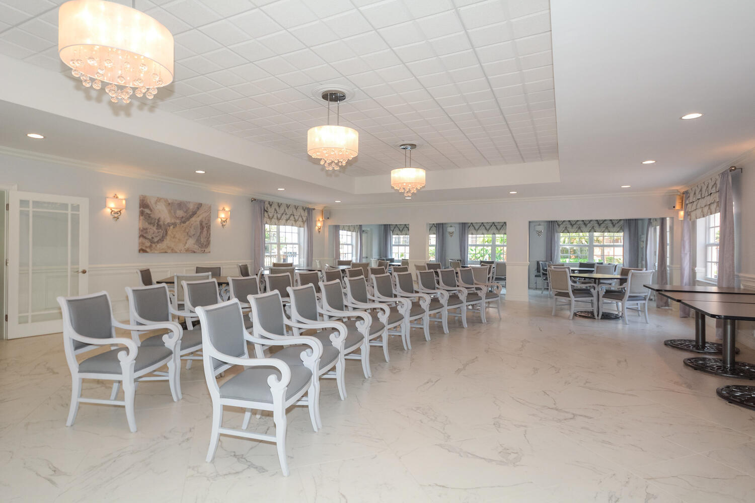 2871 North Ocean Boulevard, Unit F429 Boca Raton, FL 33431 - Photo 31 of 38 a large room with lots of chairs and mirrors