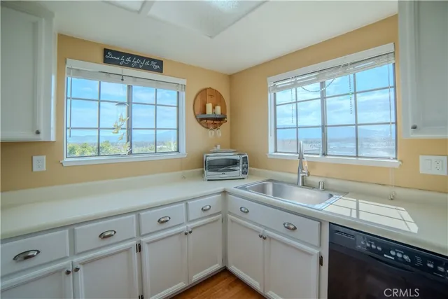 a kitchen with a stove and a sink
