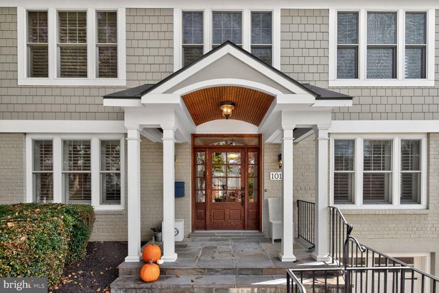 front view of a brick house with a large windows