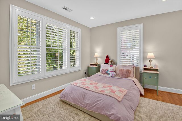 a bedroom with a bed and a table