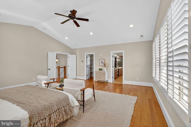 a bedroom with bed and window