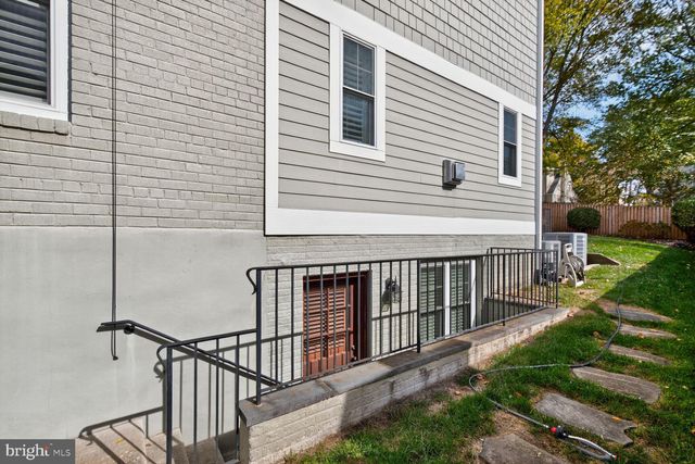 a view of a house with backyard and porch