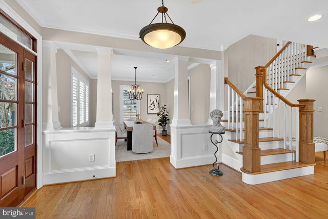 a view of a livingroom with furniture and hardwood floor