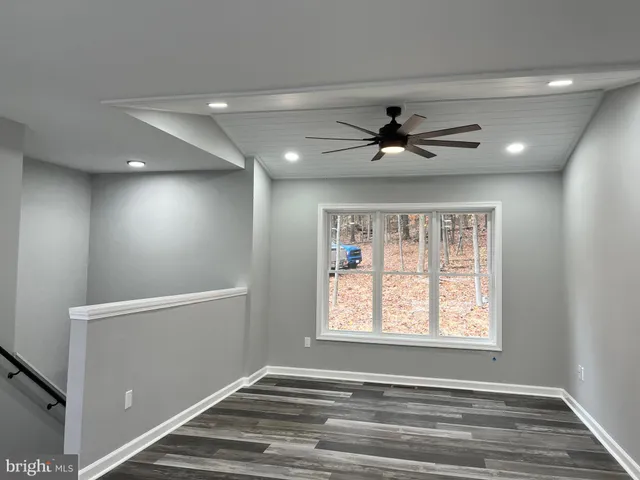 a kitchen with kitchen island a stove and a refrigerator