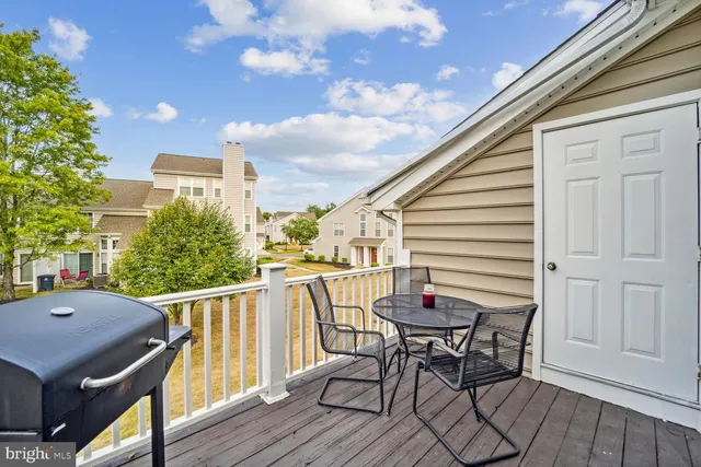 a view of a terrace with furniture and stove