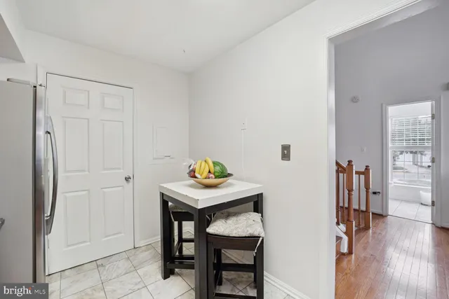 a view of kitchen island with furniture and wooden floor
