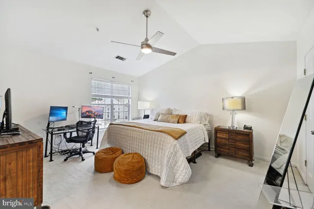 a bed room with a bed furniture and a window