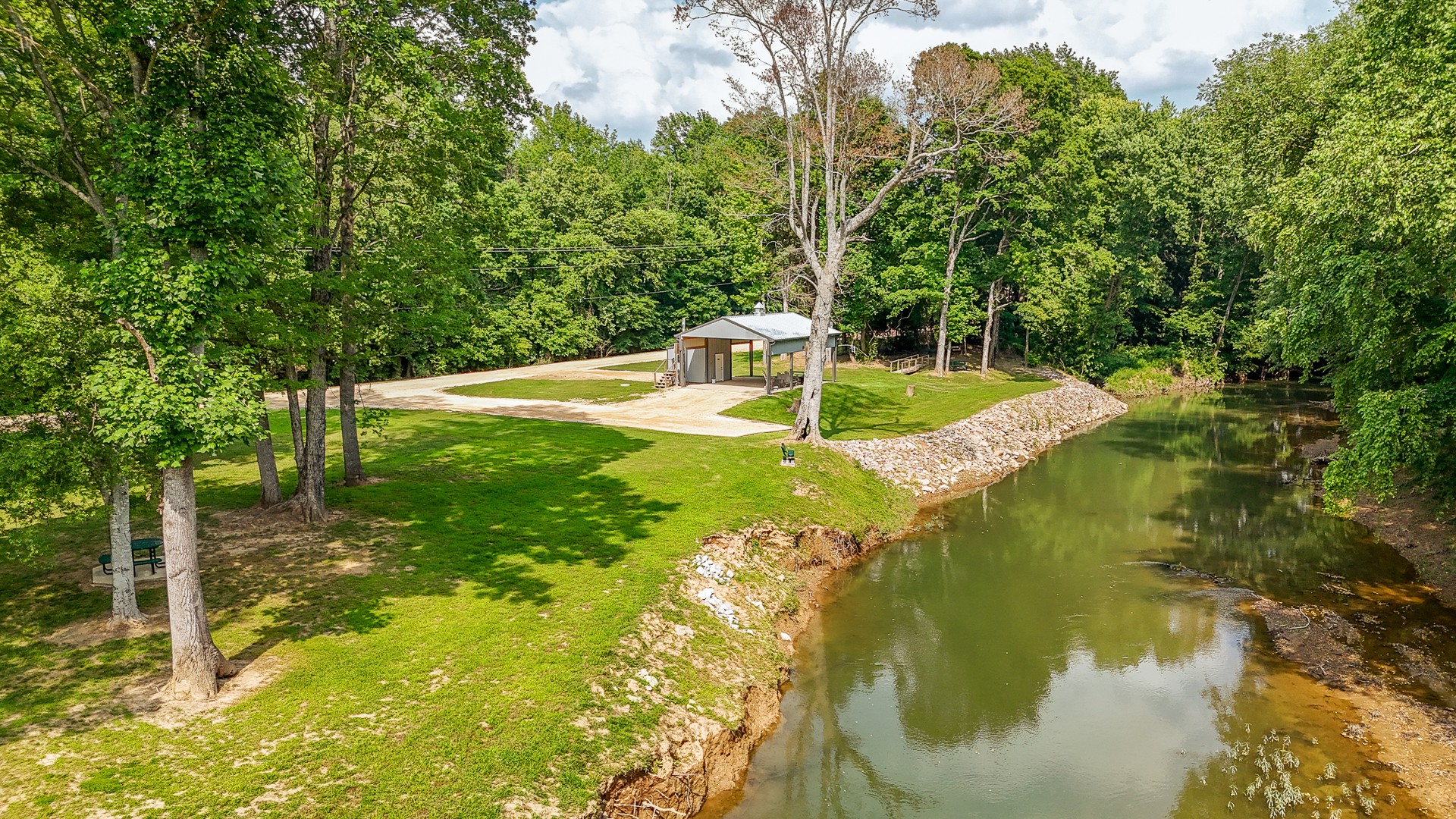 1820 Pinhook Road Savannah, TN 38372 - Photo 1 of 57 a swimming pool with trees in the background
