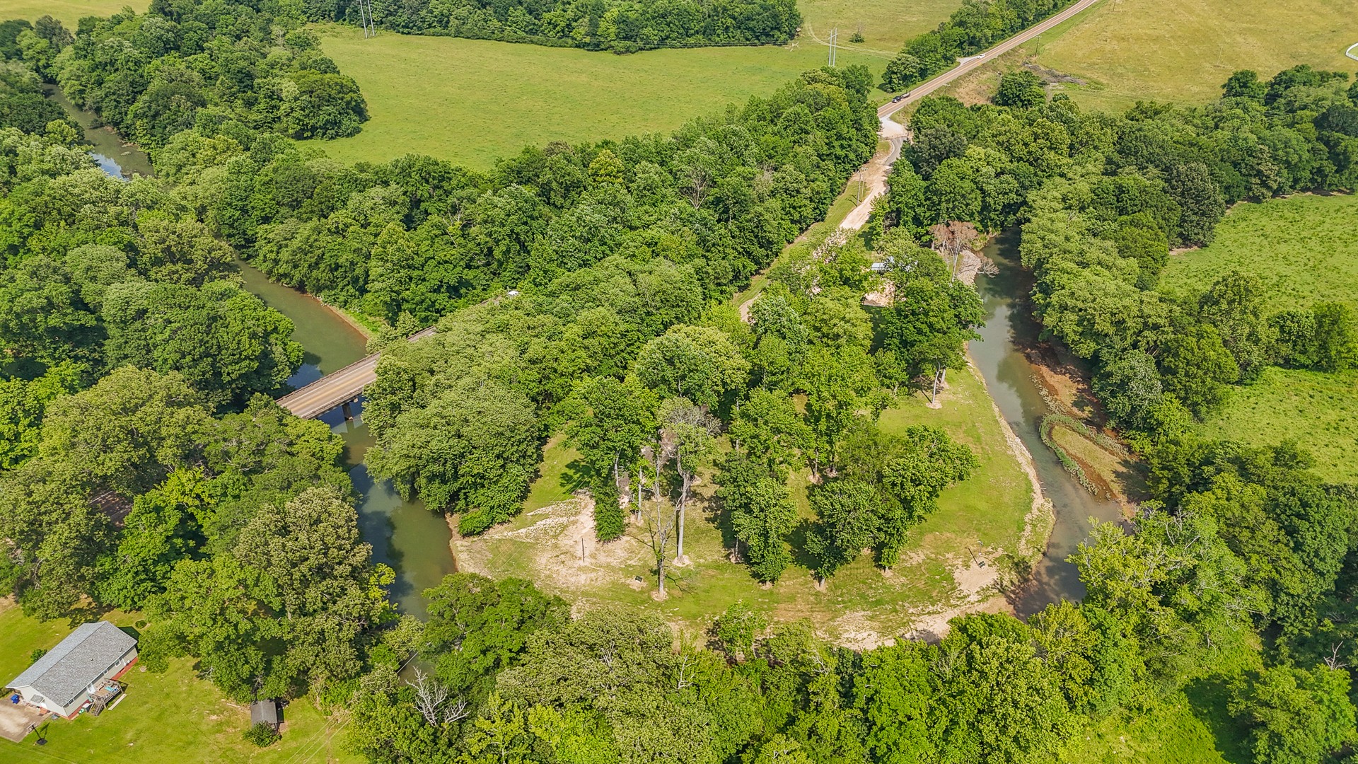 1820 Pinhook Road Savannah, TN 38372 - Photo 14 of 57 a view of a lake with a yard