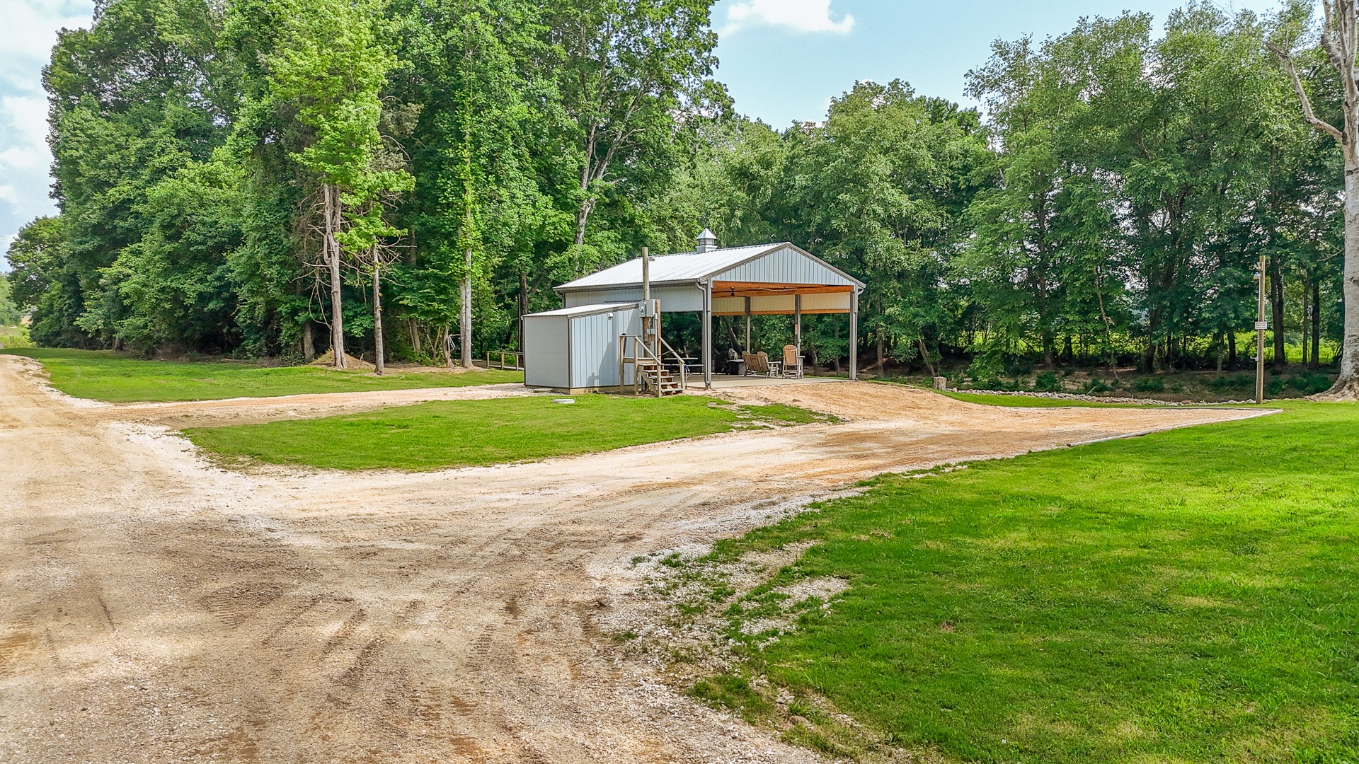 1820 Pinhook Road Savannah, TN 38372 - Photo 26 of 57 a front view of a house with a yard and trees