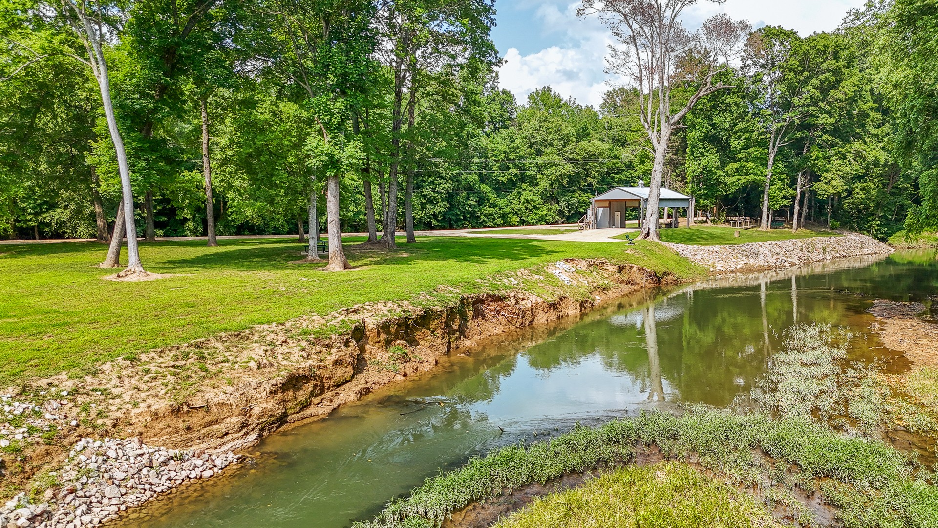 1820 Pinhook Road Savannah, TN 38372 - Photo 34 of 57 a view of a lake with a house in the background