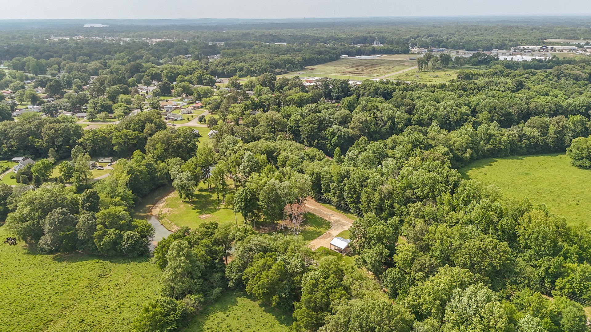 1820 Pinhook Road Savannah, TN 38372 - Photo 52 of 57 an aerial view of residential houses with outdoor space and trees