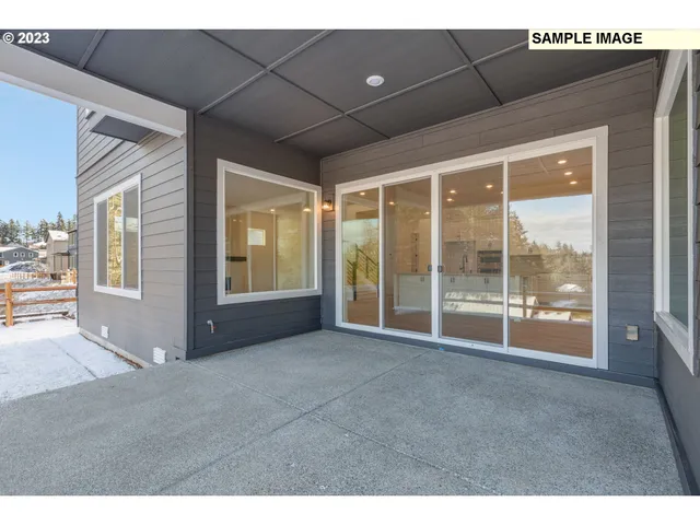 a bathroom with a sink a toilet a mirror and shower