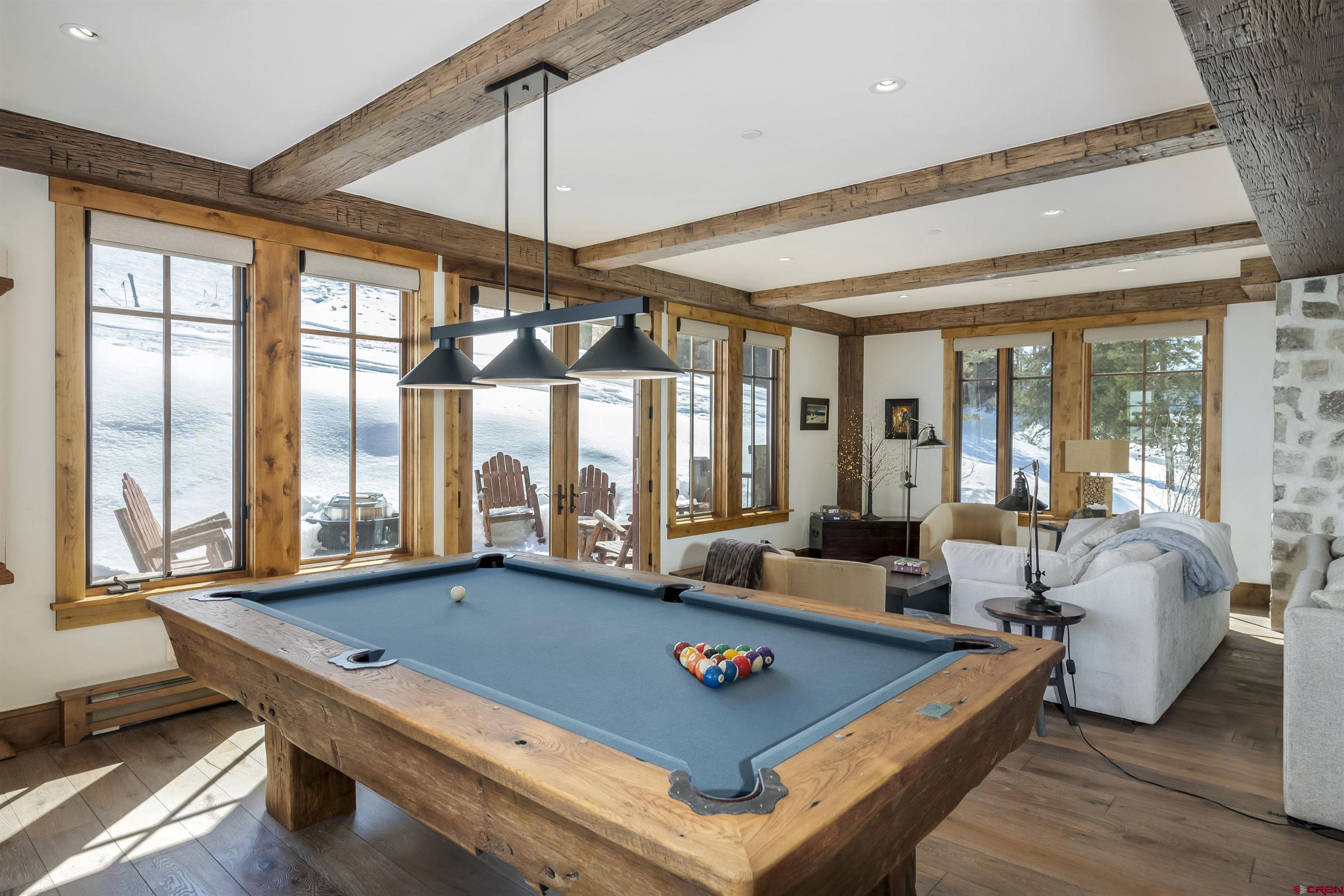 14 Hunter Hill Road, Unit C205 Crested Butte, CO 81225 - Photo 12 of 33 a room with furniture pool table and windows