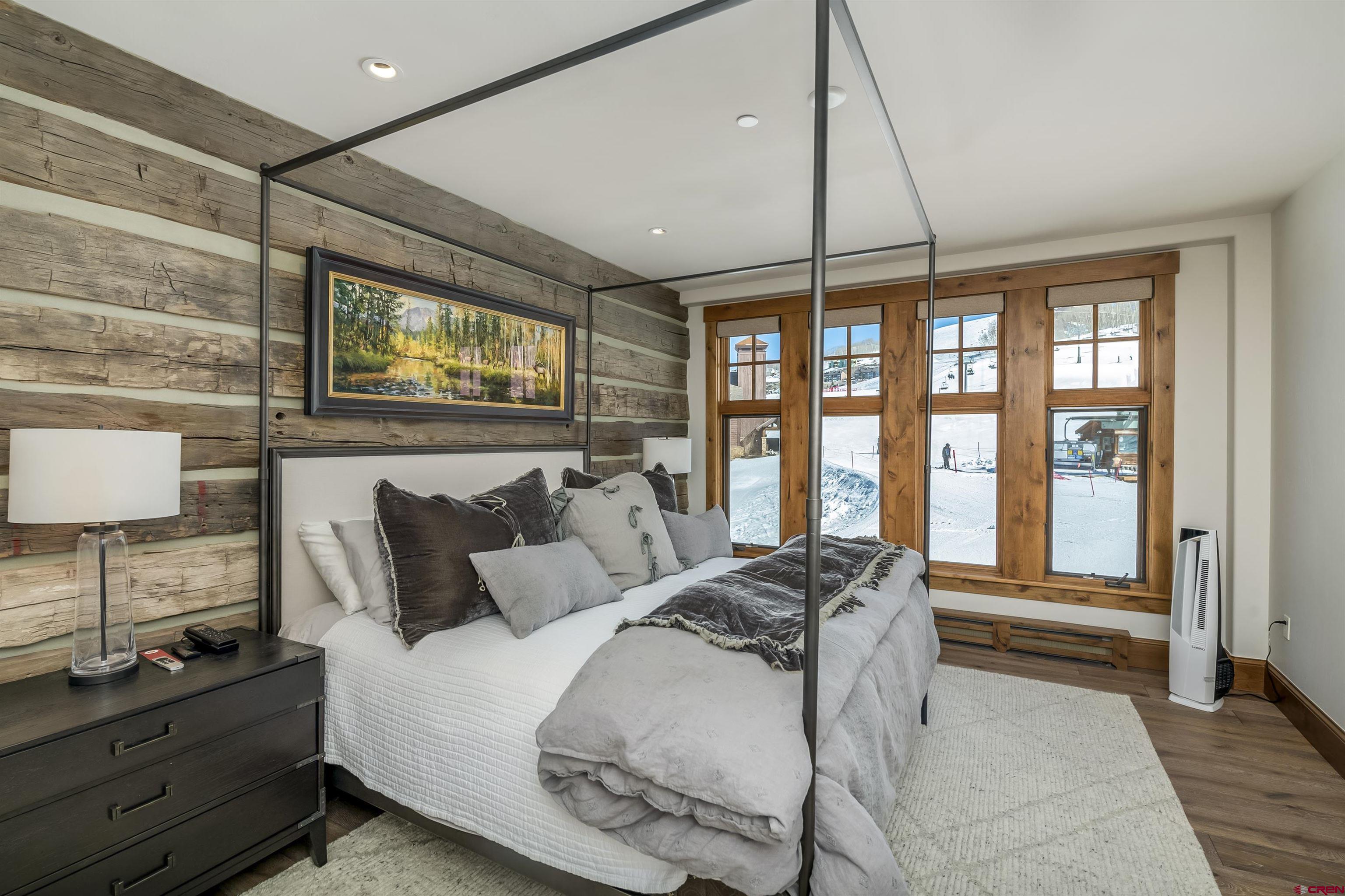 14 Hunter Hill Road, Unit C205 Crested Butte, CO 81225 - Photo 15 of 33 a bedroom with a bed and large window