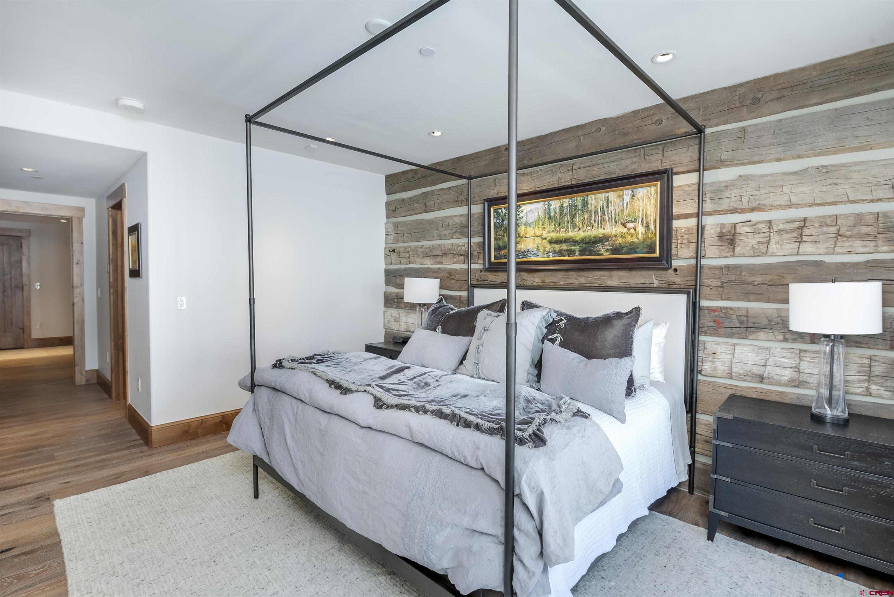 14 Hunter Hill Road, Unit C205 Crested Butte, CO 81225 - Photo 16 of 33 a bedroom with a bed and large window