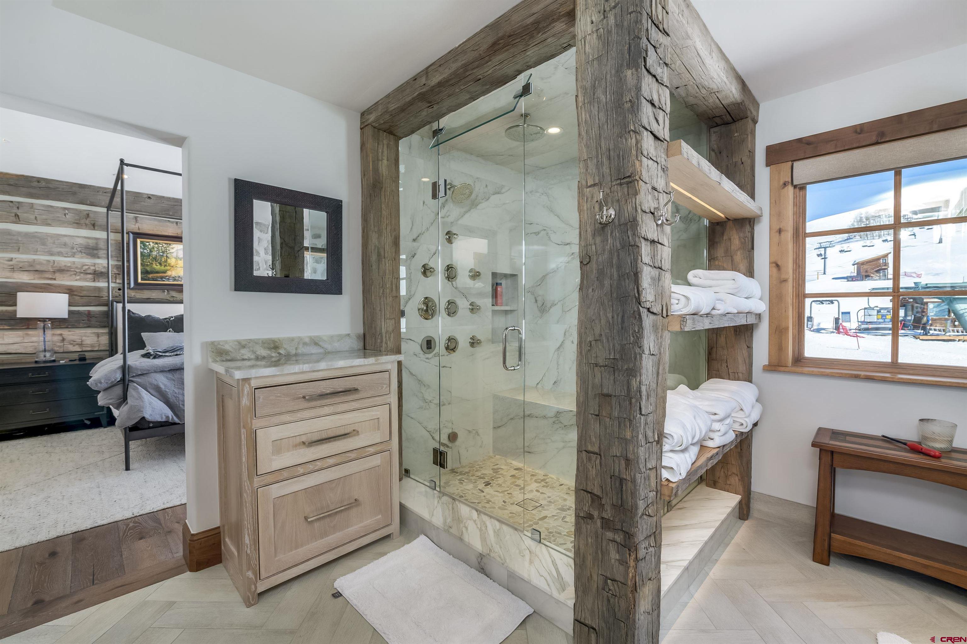 14 Hunter Hill Road, Unit C205 Crested Butte, CO 81225 - Photo 18 of 33 a bathroom with a bathtub shower and a sink