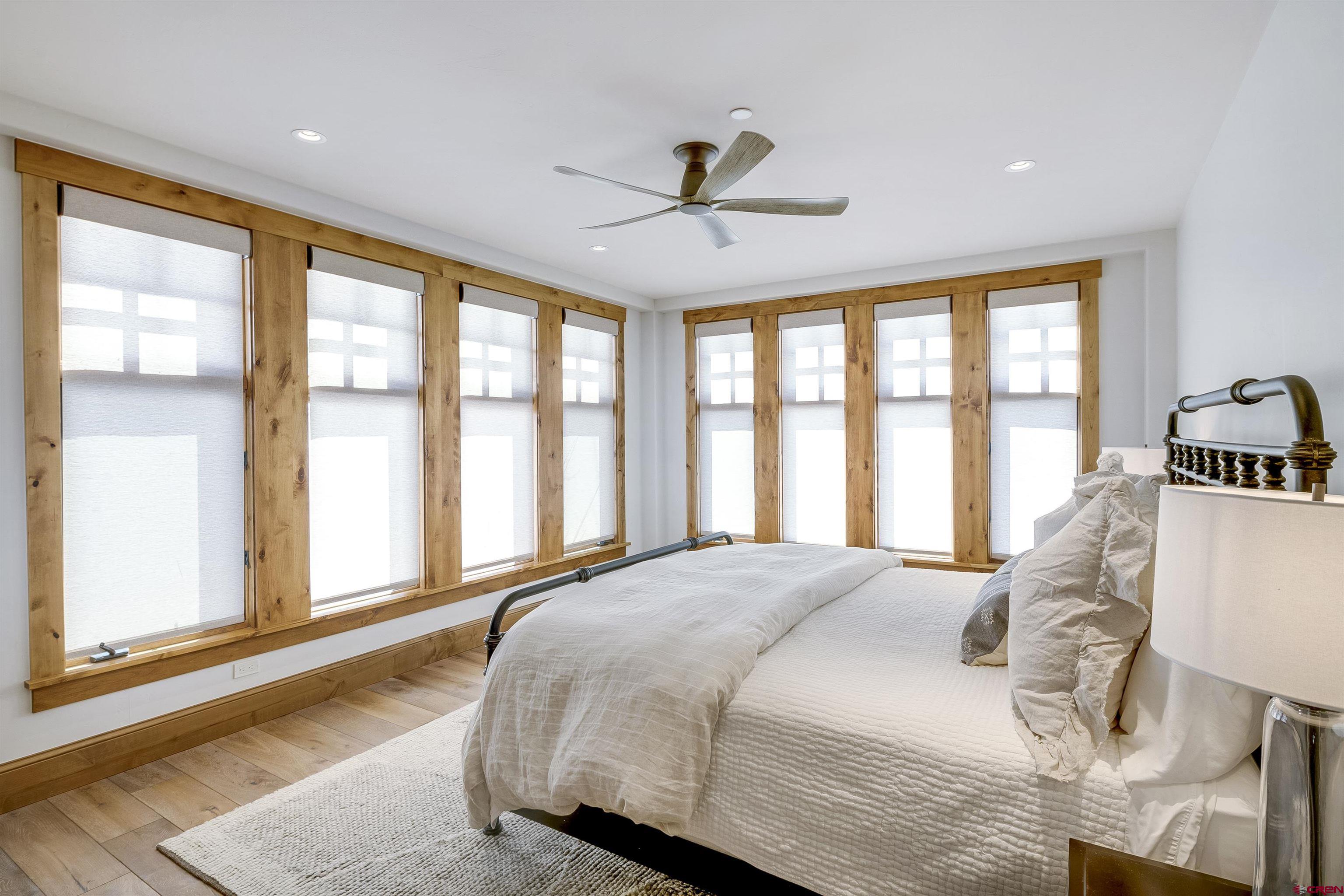 14 Hunter Hill Road, Unit C205 Crested Butte, CO 81225 - Photo 20 of 33 a bedroom with a large bed and a large window