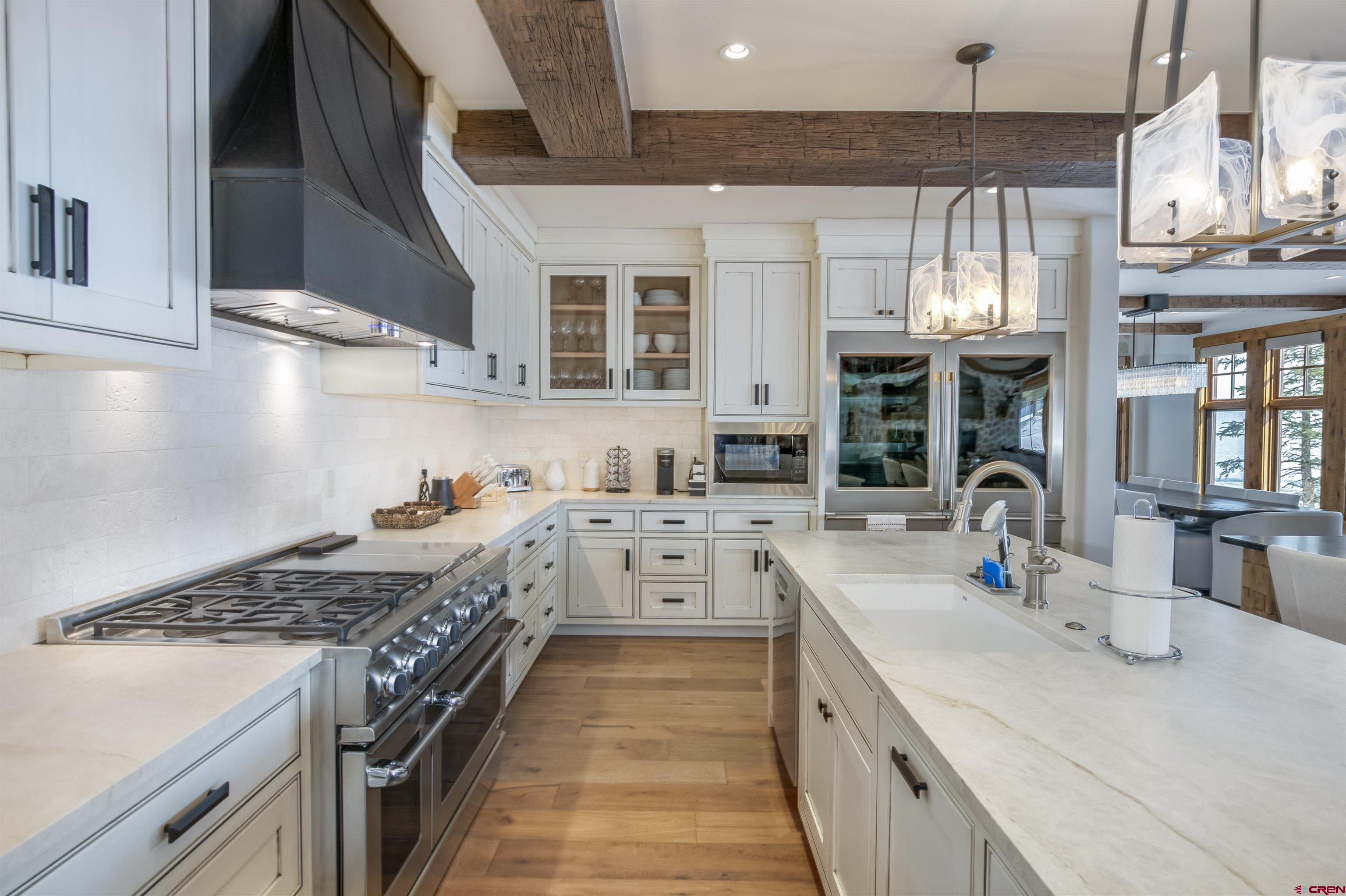 14 Hunter Hill Road, Unit C205 Crested Butte, CO 81225 - Photo 7 of 33 a kitchen with stainless steel appliances granite countertop a stove and a sink