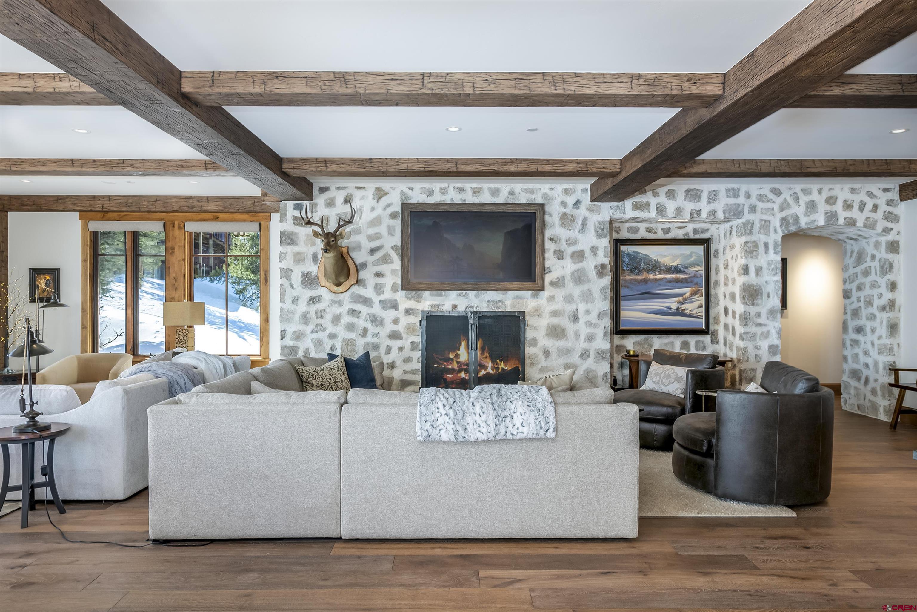 14 Hunter Hill Road, Unit C205 Crested Butte, CO 81225 - Photo 8 of 33 a living room with fireplace furniture and a large window