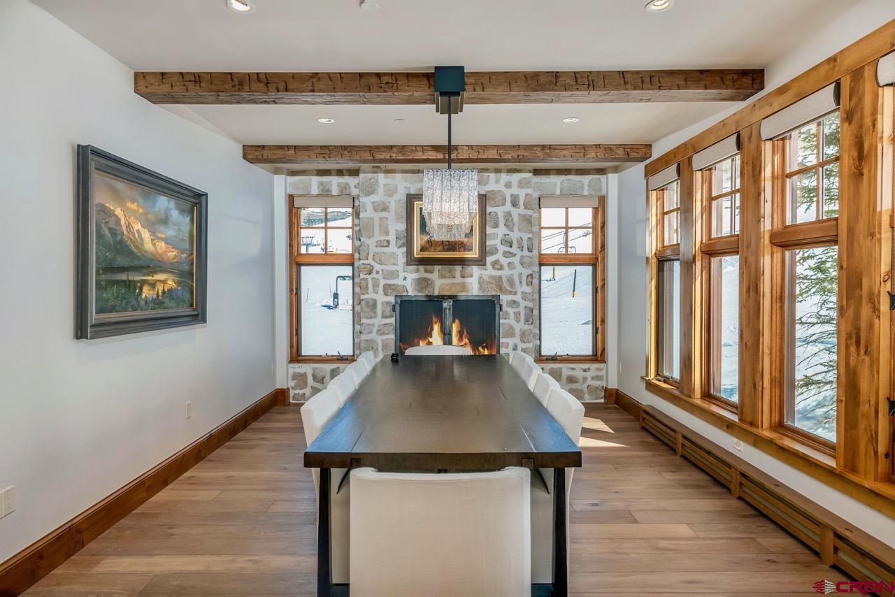 14 Hunter Hill Road, Unit C205 Crested Butte, CO 81225 - Photo 10 of 33 a living room with furniture and a chandelier