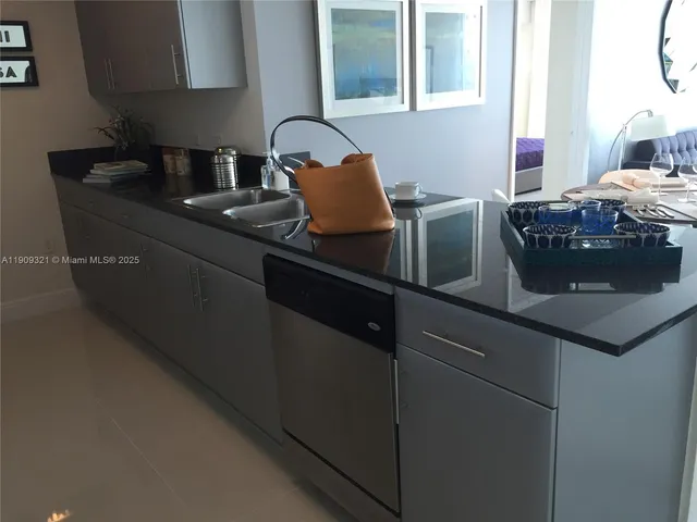 a kitchen with a cabinets and white appliances