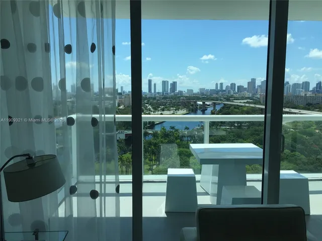 a view of a balcony with furniture