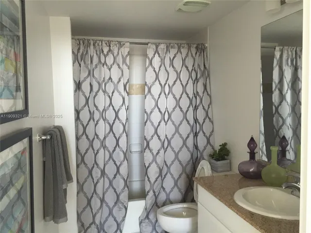 a bathroom with a toilet and a sink