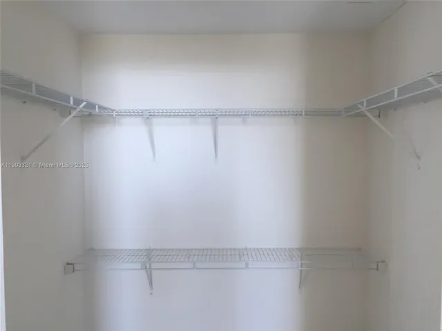 a view of a room with racks on the wall