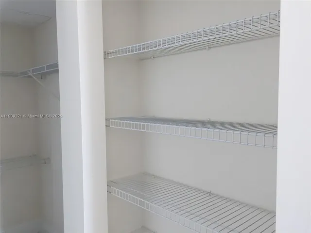 a view of small space with racks on the wall