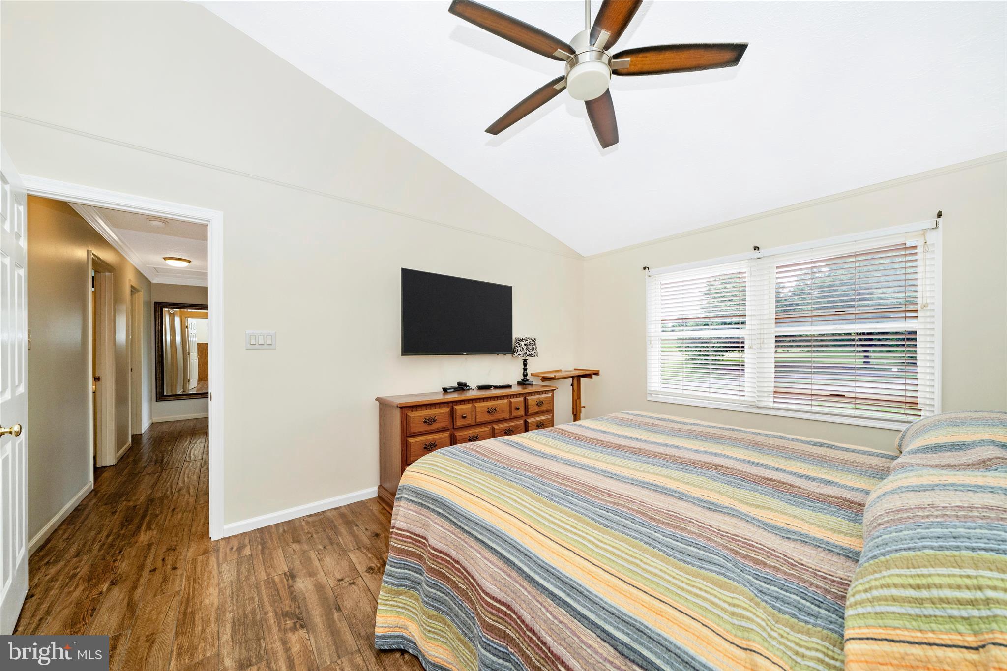 9534 Liberty Road Frederick, MD 21701 - Photo 30 of 70 a bedroom with a bed and a flat screen tv