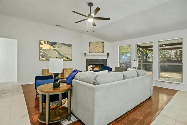 a living room with furniture and a fireplace