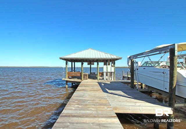 25773 Canal Road, Unit 26 Orange Beach, AL 36561 - Photo 25 of 42 Walk down to the gazebo on the pier and watch the dolphins play in the water or catch a fish for dinner.